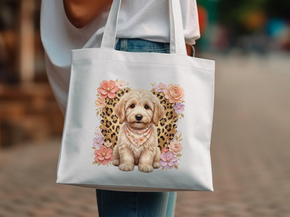White tote bag with a cute doodle dog wearing a bandana and floral accents.