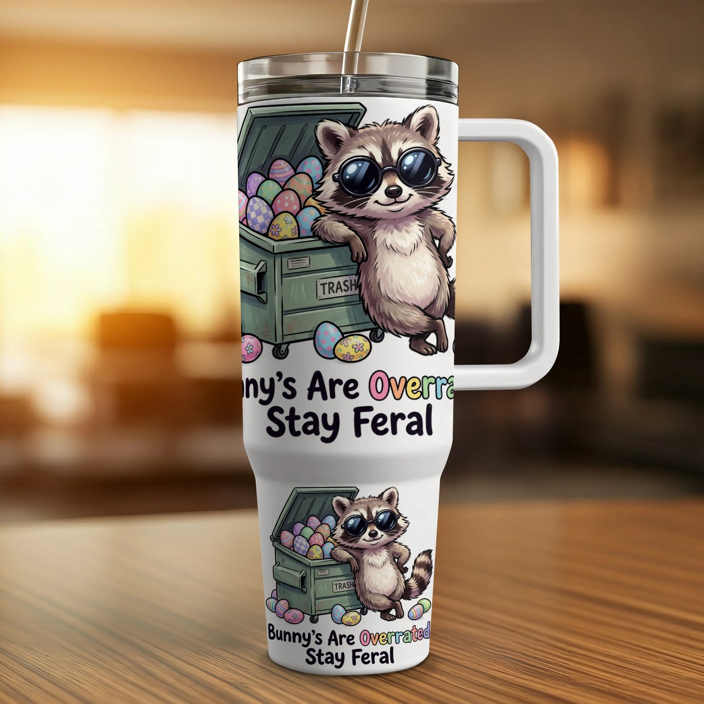 Raccoon wearing sunglasses leans against a trash can; text reads "Bunny's Are Overrated Stay Feral."
