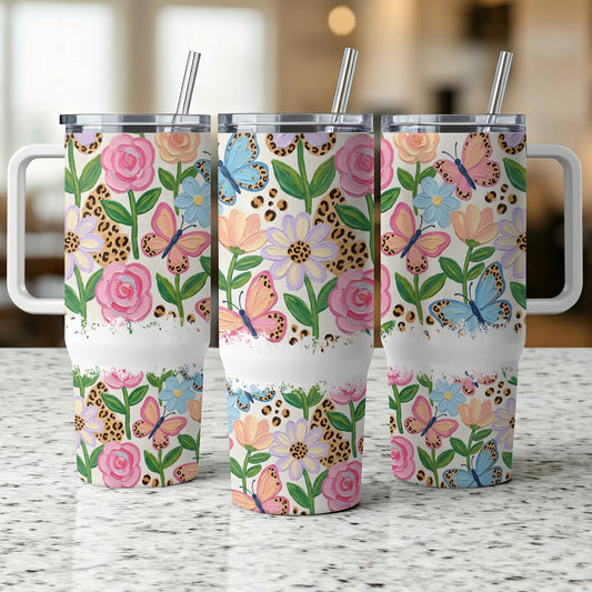 Three floral and butterfly patterned tumblers with leopard print accents.