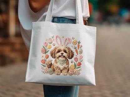 White tote bag with embroidered Easter dog wearing bunny ears and a floral wreath.