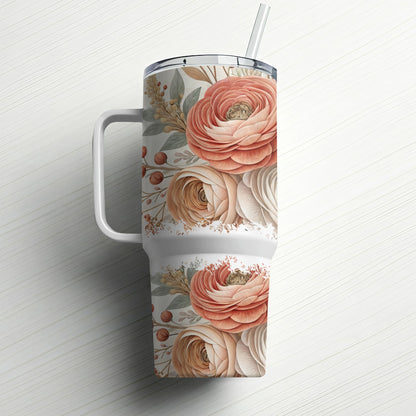Floral patterned tumbler with handle and straw.