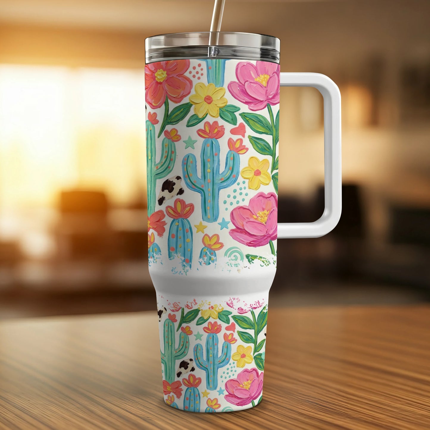 Tumbler with cactus, cow print, and floral pattern.