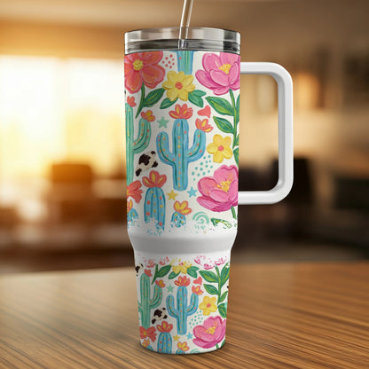 Tumbler with cactus, cow print, and floral pattern.