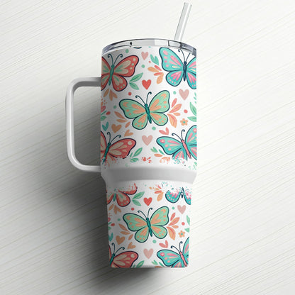 White tumbler with colorful butterfly and heart pattern and straw.