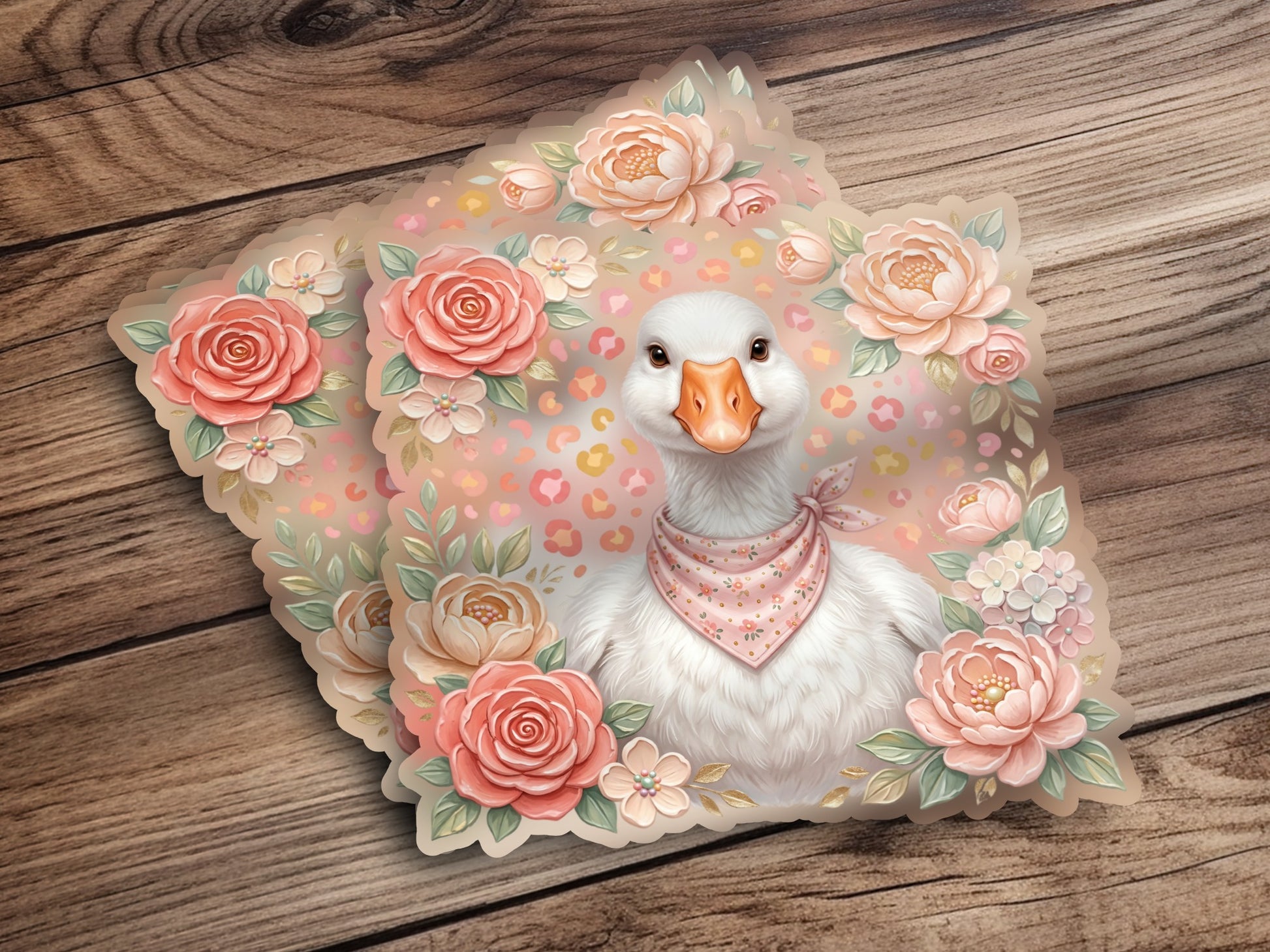 White goose wearing pink bandana, surrounded by pastel flowers on a wooden background.