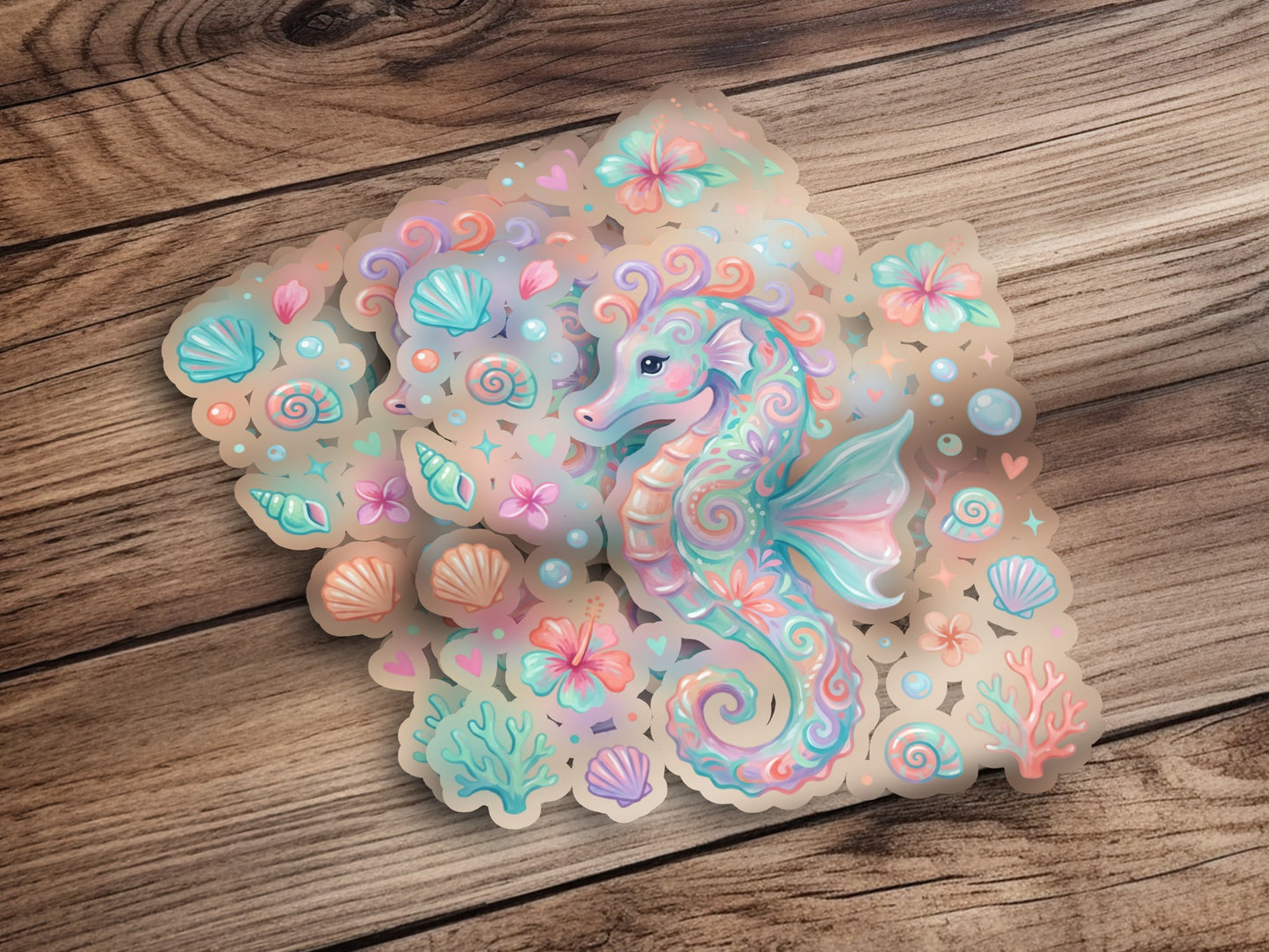 Seahorse sticker with pastel floral and shell accents on a wooden background.