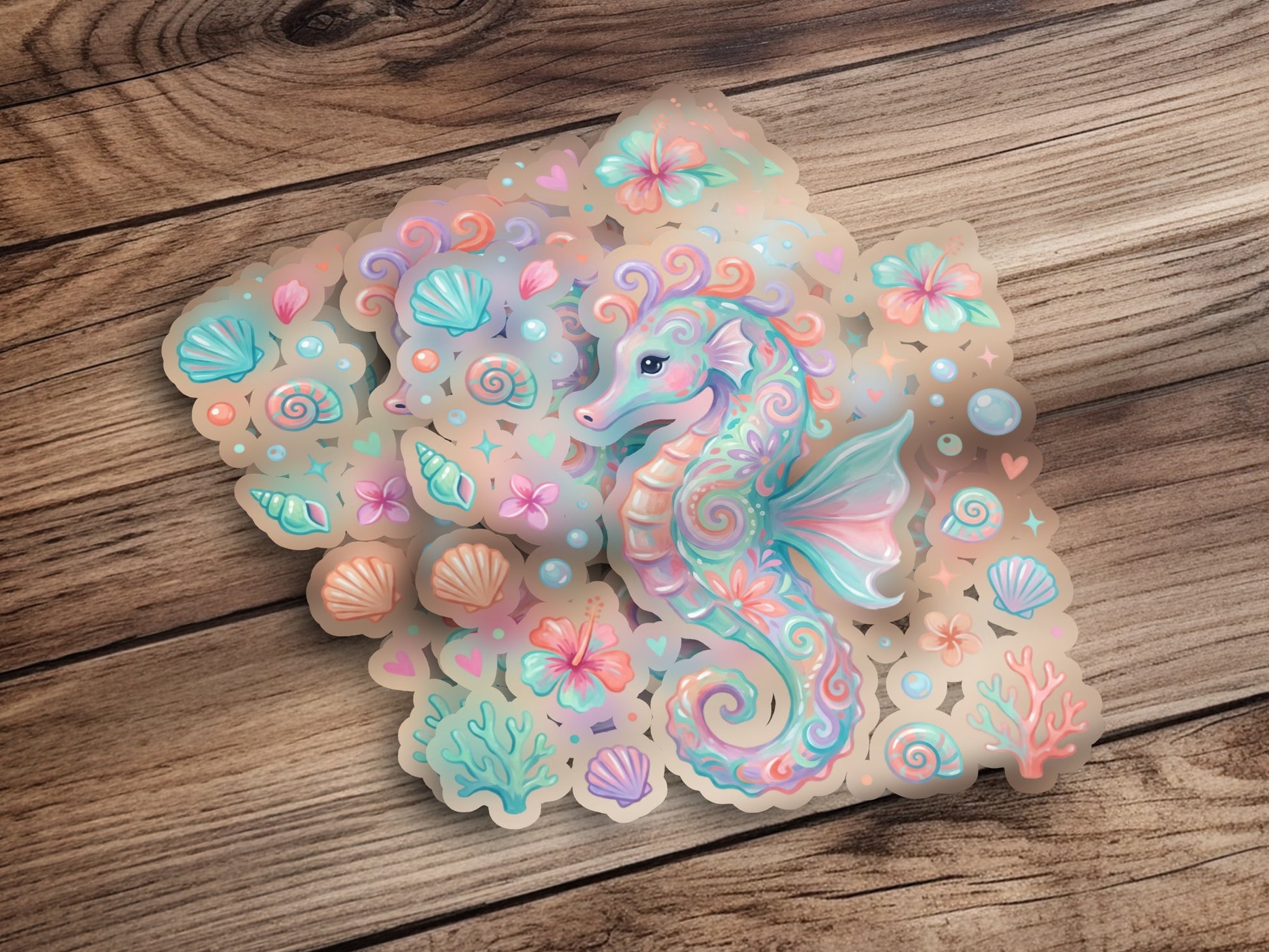 Seahorse sticker with pastel floral and shell accents on a wooden background.