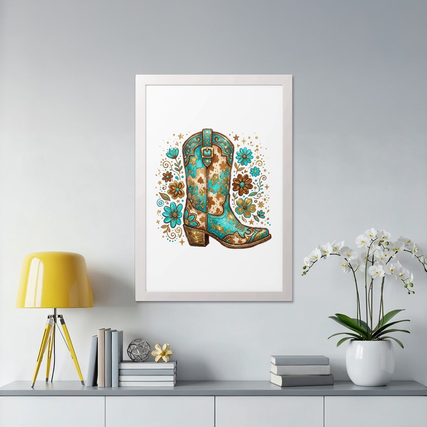 Turquoise cowboy boot with floral and star pattern in a white frame.