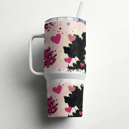 Tumbler with pink hearts and cow print pattern, includes straw.