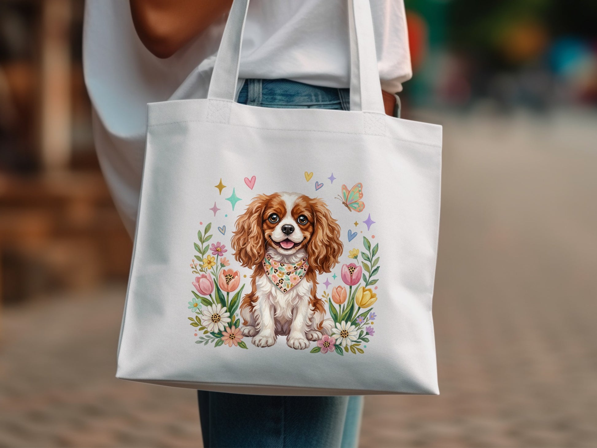 White tote bag with watercolor Cavalier King Charles Spaniel and floral border.