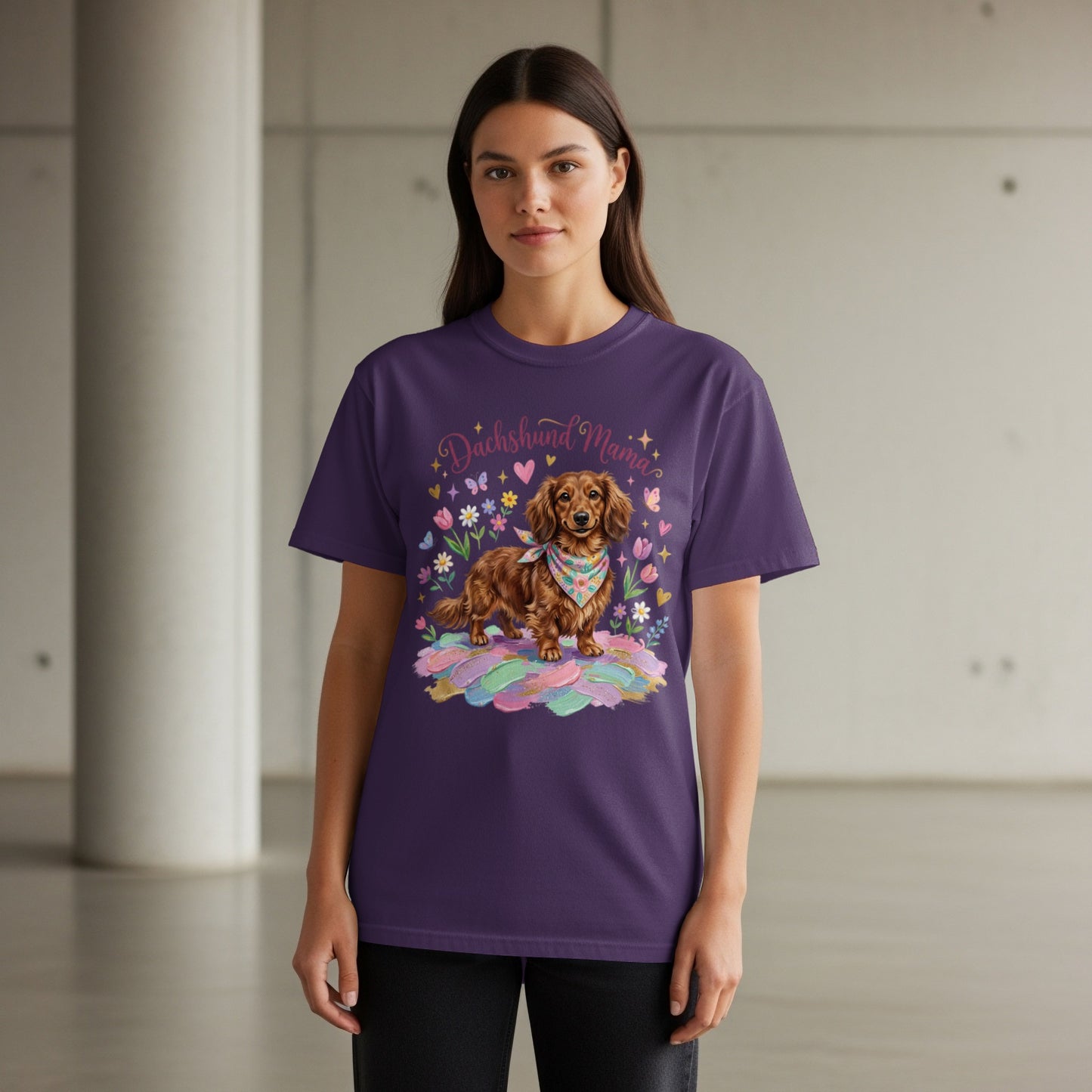 Woman wearing a purple t-shirt with a dachshund and floral design.