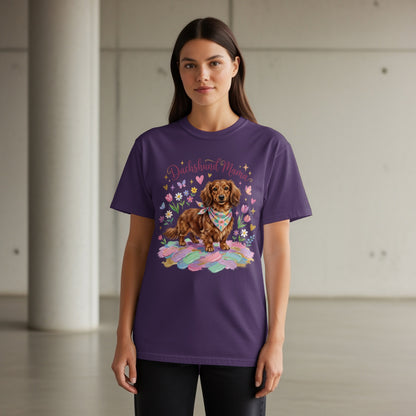 Woman wearing a purple t-shirt with a dachshund and floral design.