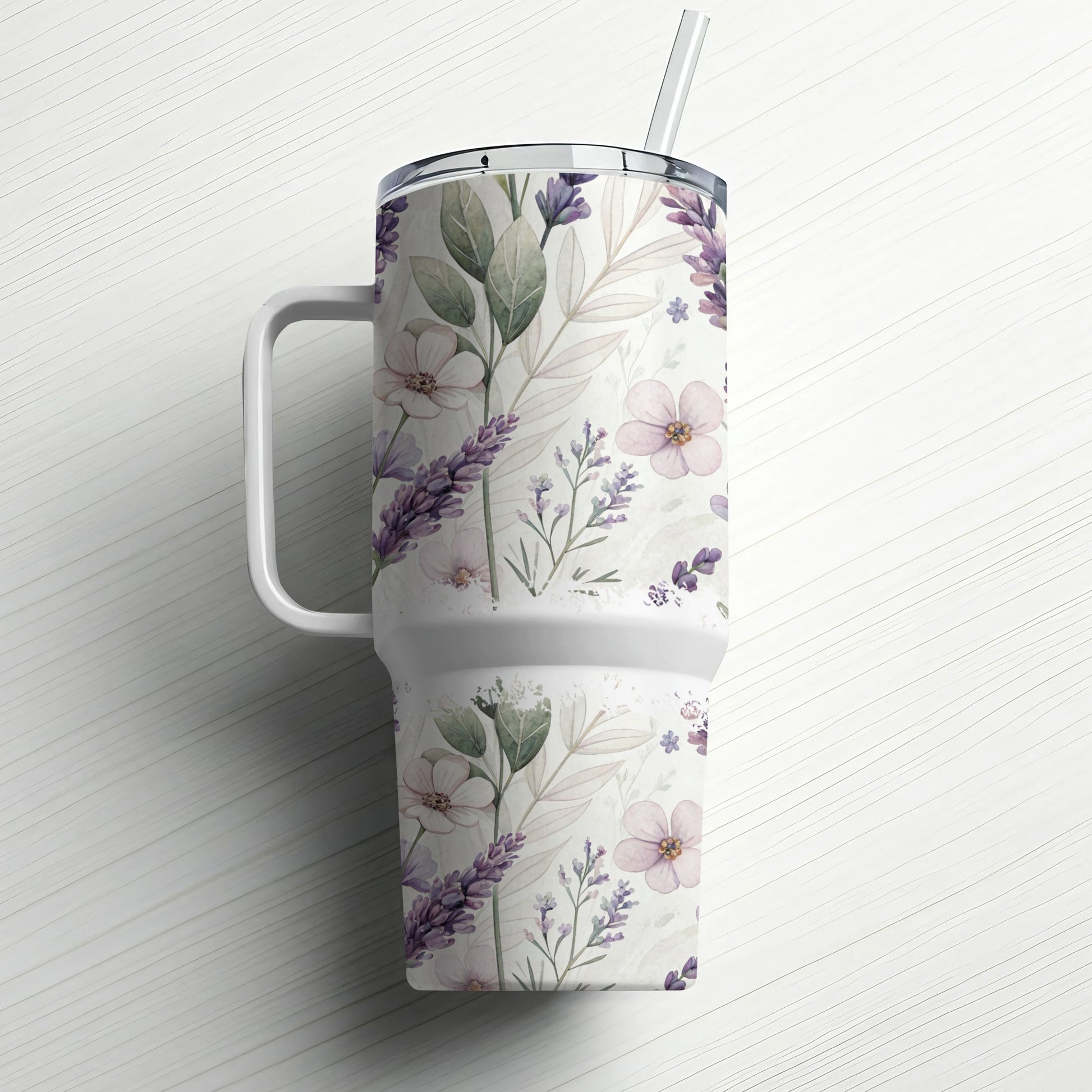 White tumbler with handle and straw, decorated with a floral and lavender pattern.