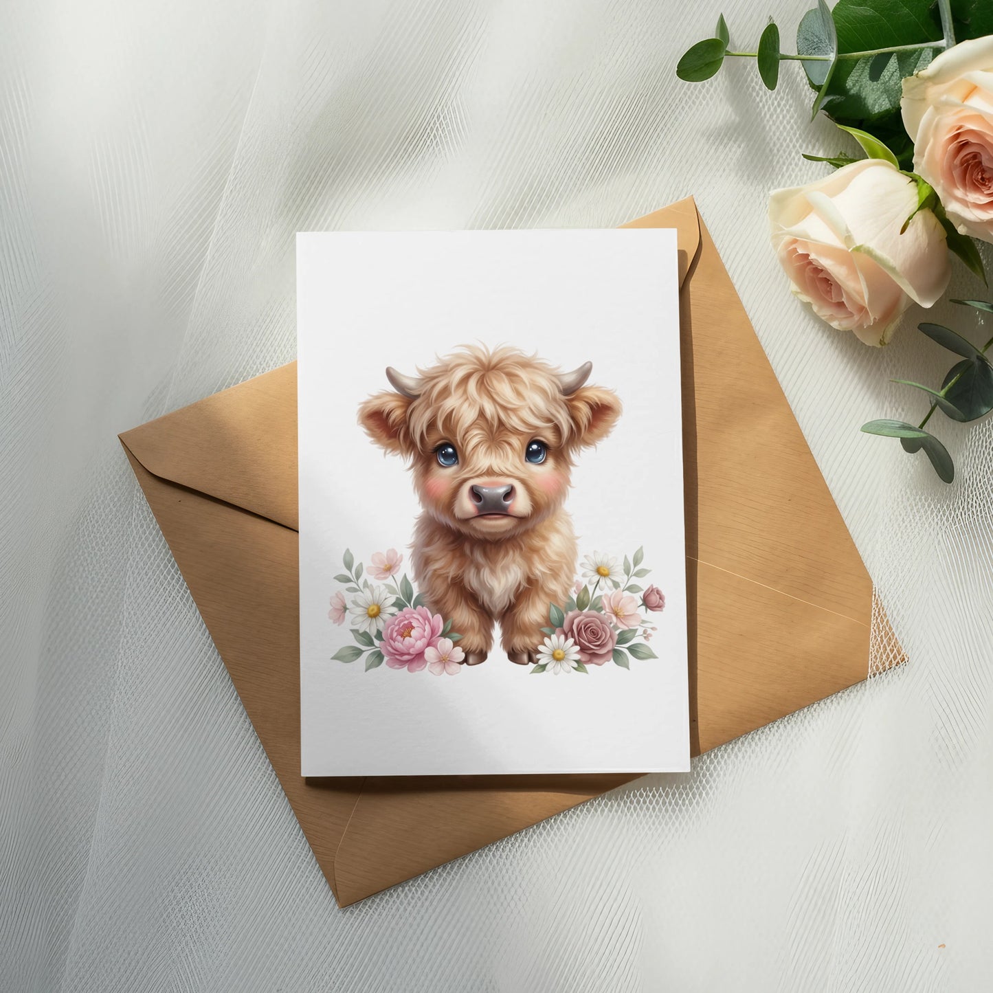 Cute fluffy Highland cow illustration on card with floral border on envelope.