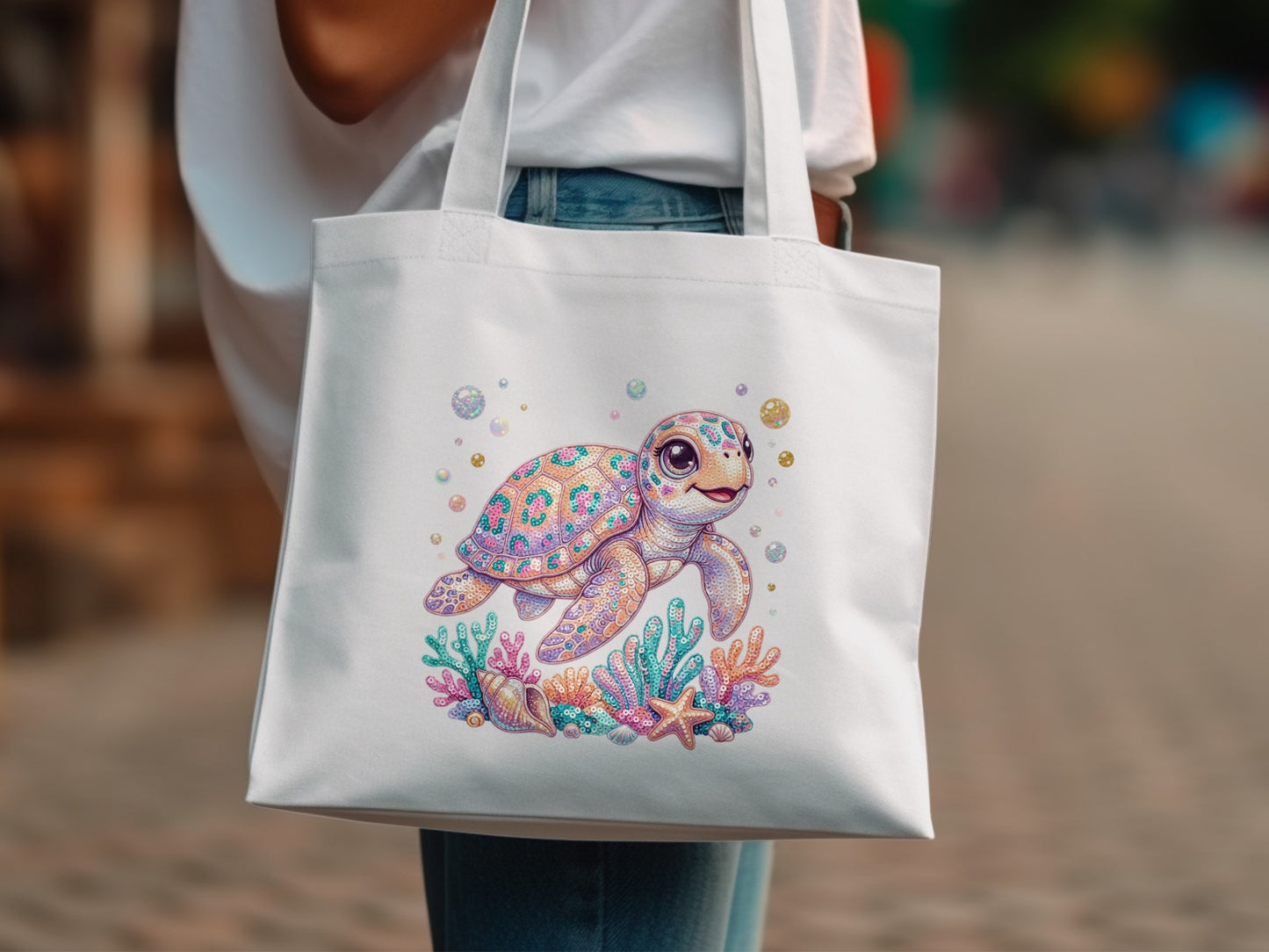 White tote bag with colorful cartoon sea turtle and coral illustration.