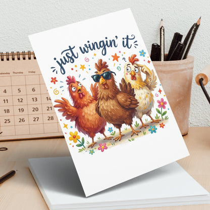 Greeting card with three cartoon chickens and the text "just wingin' it."