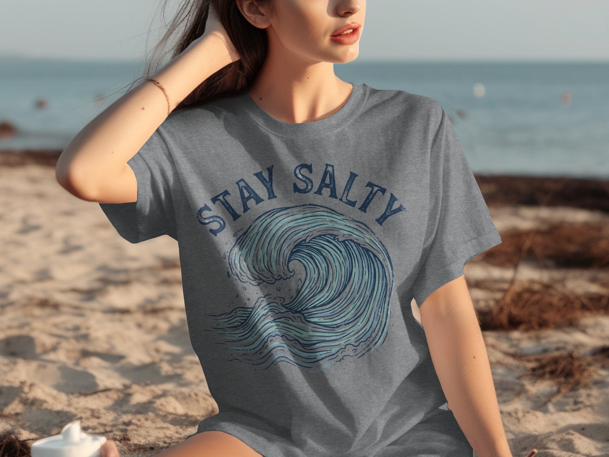 Grey t-shirt with "STAY SALTY" and a blue wave graphic.