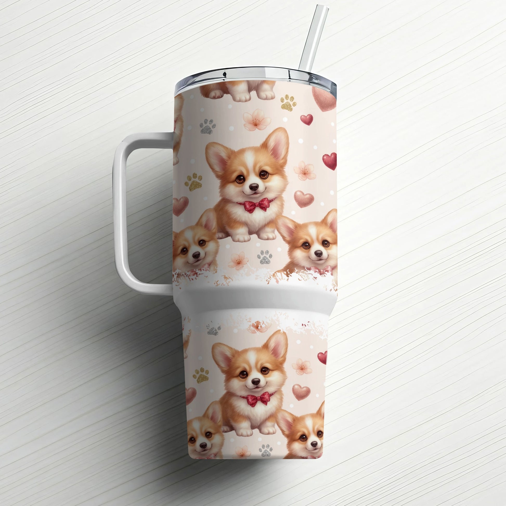 Corgo puppies with red bows on a patterned tumbler with straw.