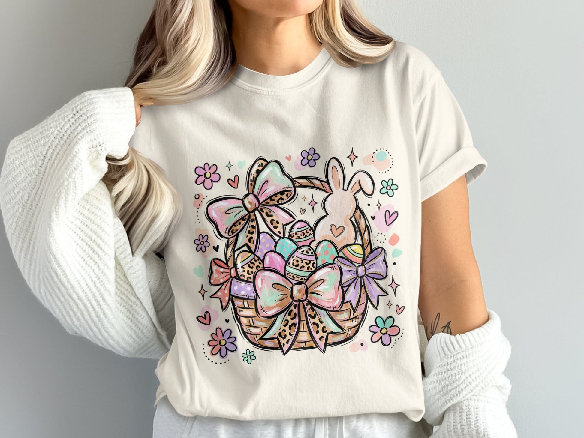 Easter basket with bunny, eggs, and pastel floral accents.