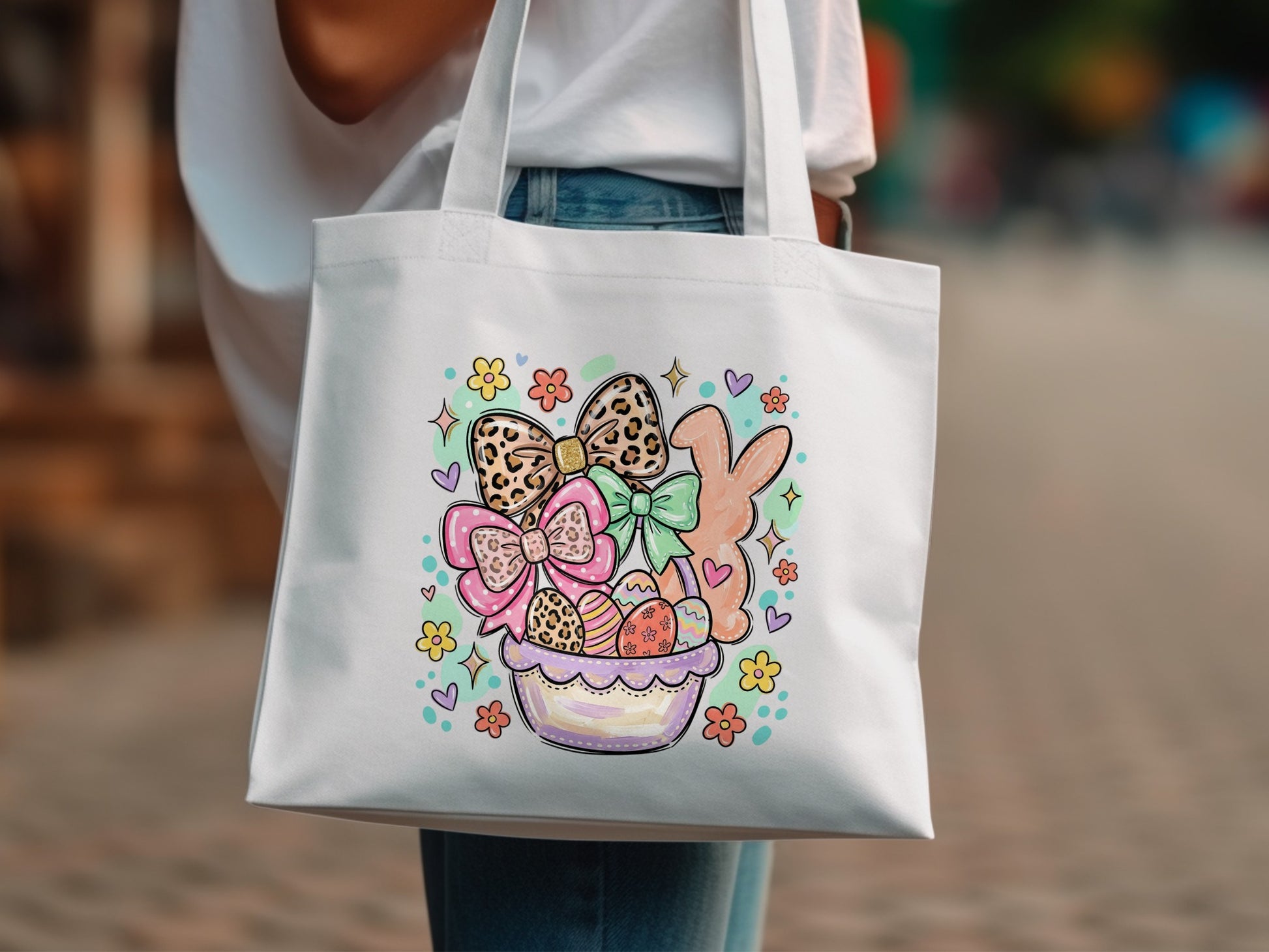 Easter tote bag with bunnies, bows, and decorated eggs in a basket.