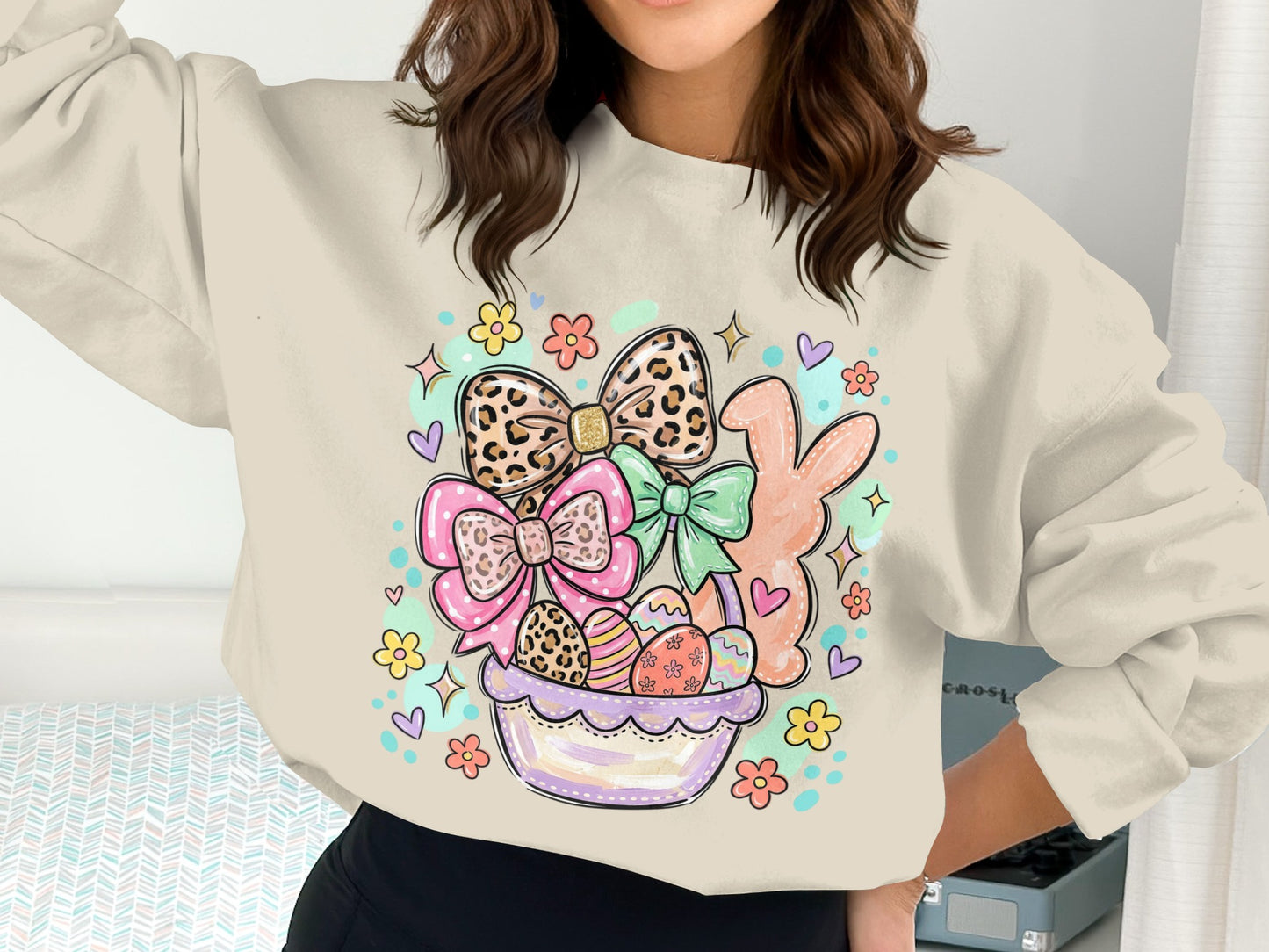 Easter basket with eggs, bows, and bunny, printed on a light-colored sweatshirt.