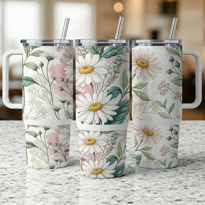 Three insulated tumblers with a floral daisy and pink watercolor design.