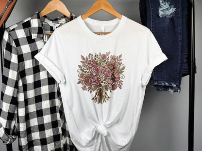 White t-shirt with a floral bouquet graphic.
