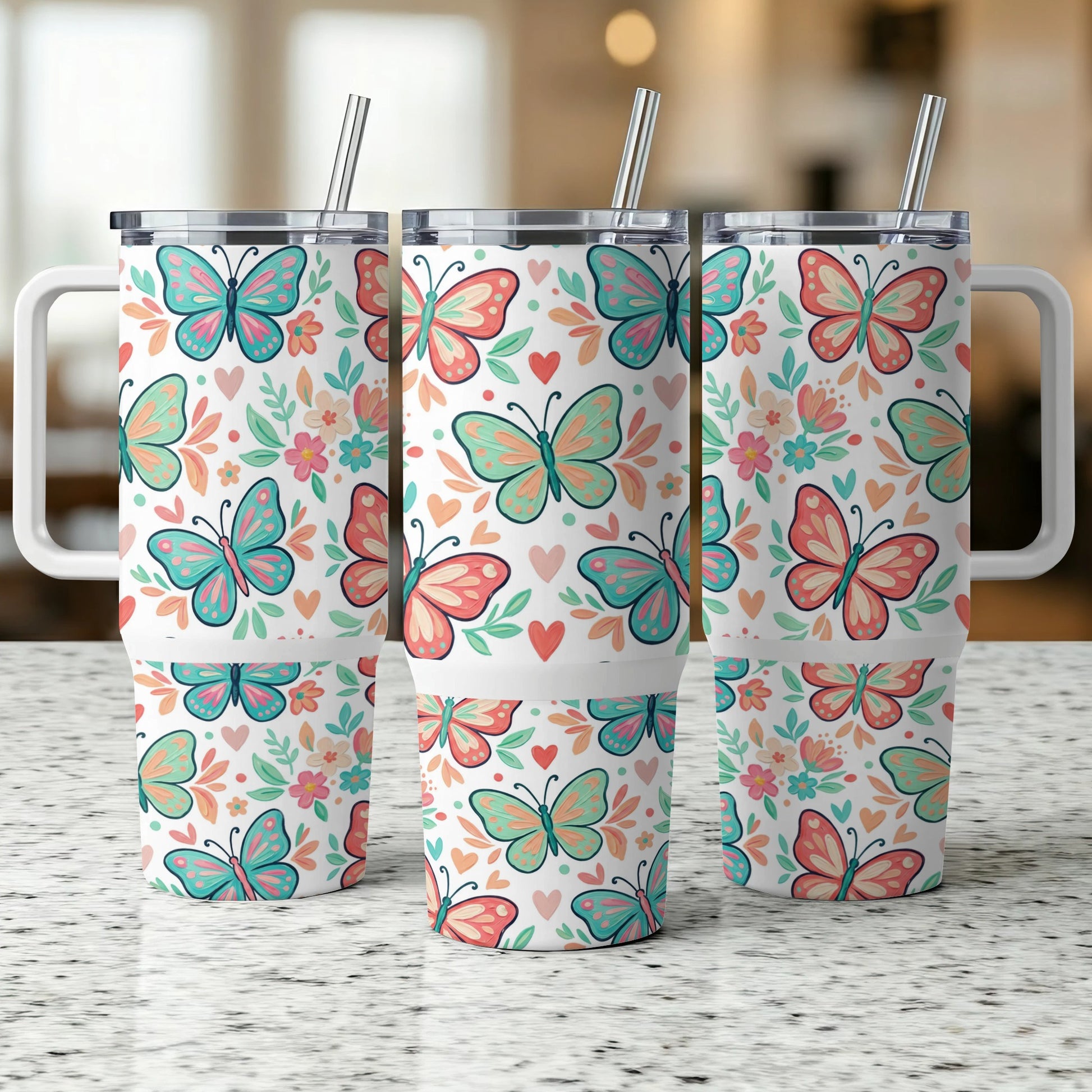 Three tumblers with a colorful butterfly and floral pattern.