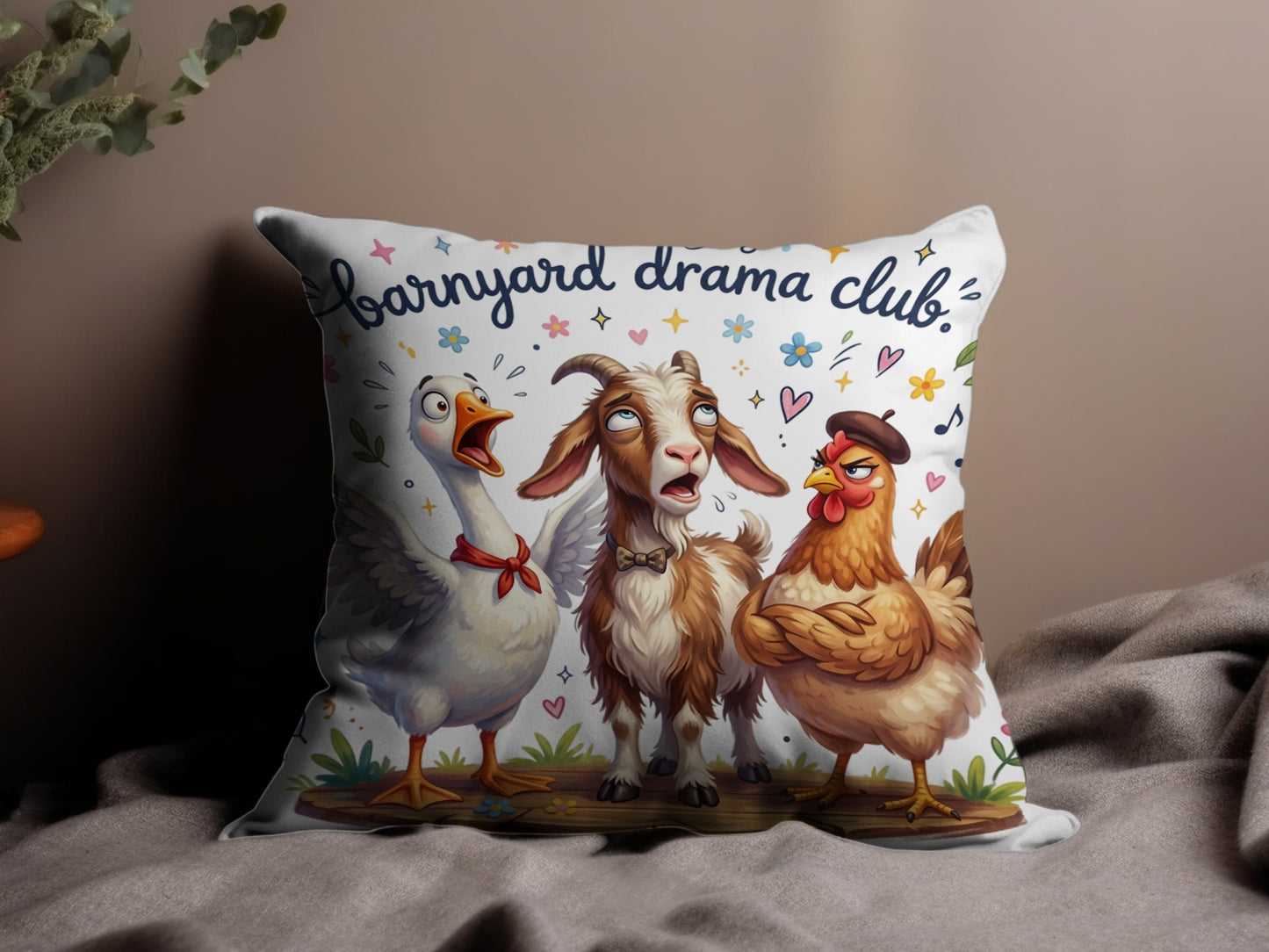 Barnyard Drama Club pillow with a goose, goat, and chicken.