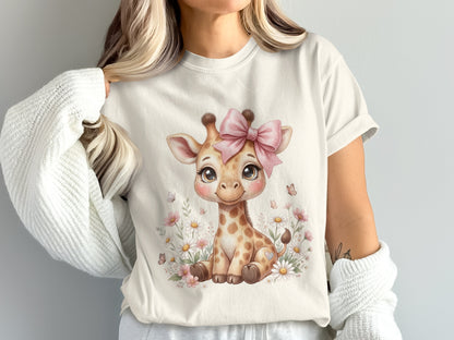 Cream t-shirt with a cartoon baby giraffe and pink bow among flowers.