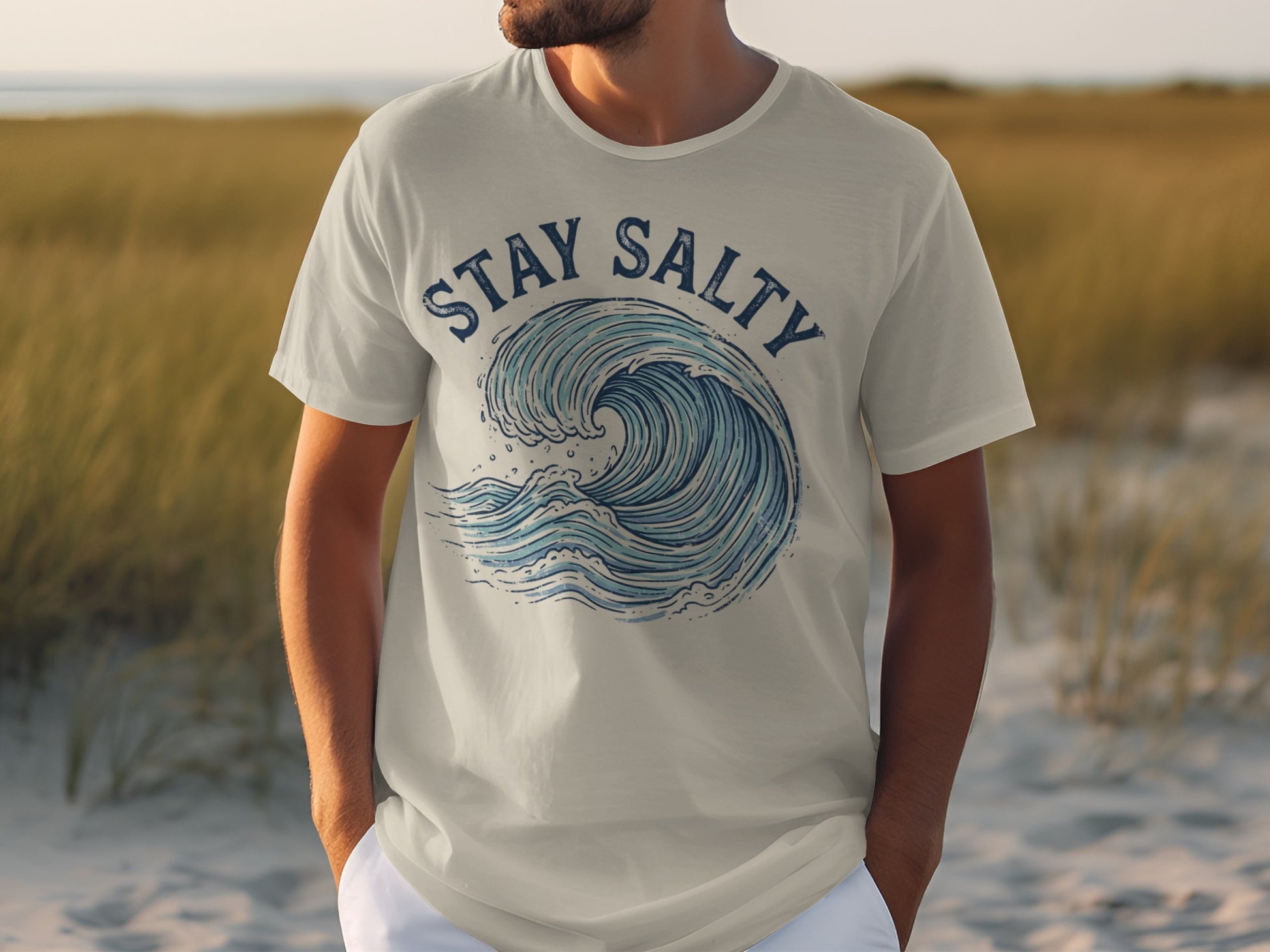 Light grey t-shirt with a blue wave graphic and "Stay Salty" text.