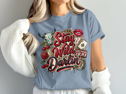 T-shirt with "Stay Wild Darlin'" text, bull skull, dice, cherries, and playing cards.