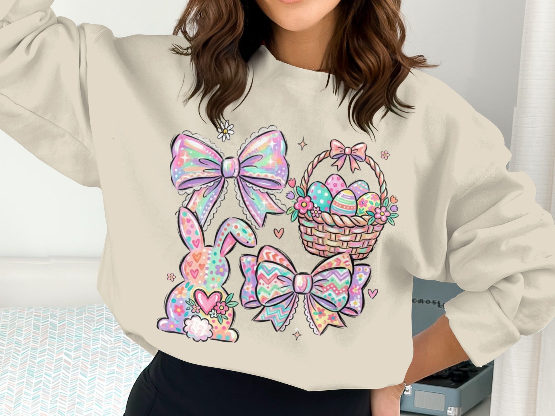 Easter graphic sweatshirt with bunny, basket of eggs, and bows.