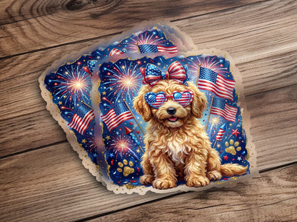 Golden doodle dog wearing heart-shaped sunglasses and bow, with fireworks and US flags.