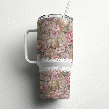 Pink floral and bunny pattern on a white insulated tumbler with straw.