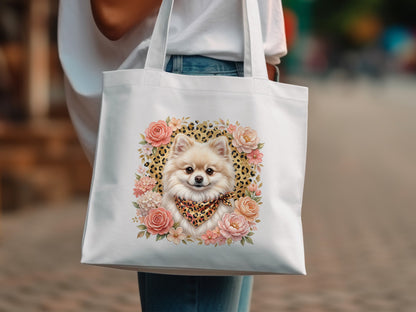 White tote bag with a fluffy Pomeranian dog wearing a bandana and surrounded by flowers.