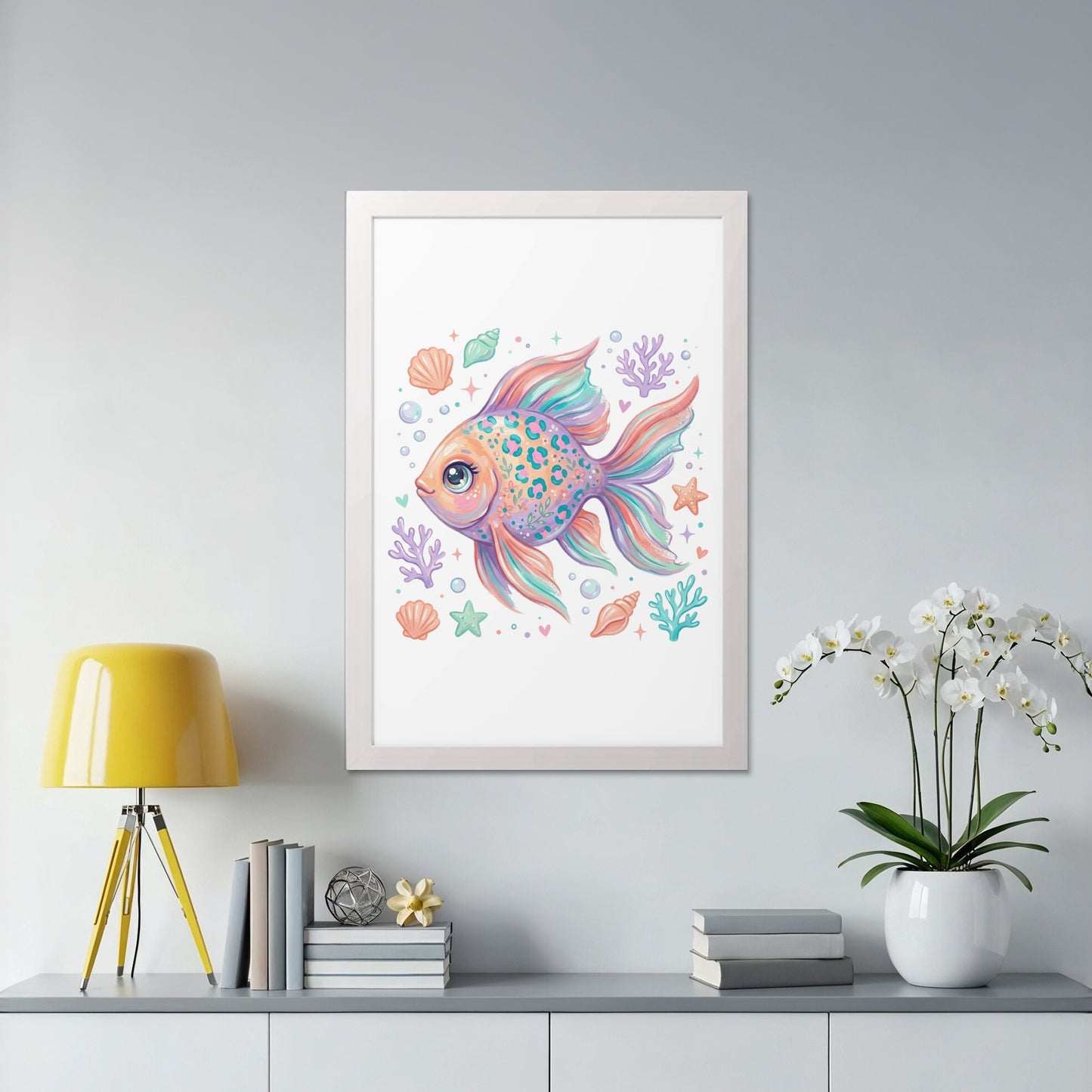 Colorful fish and seashells art print in a white frame.
