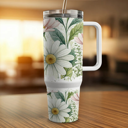 White tumbler with handle featuring a watercolor floral daisy and greenery design.