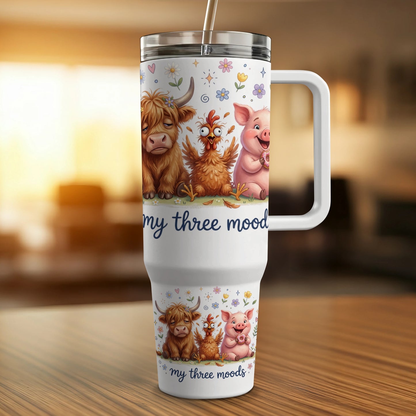 White tumbler with cartoon cow, chicken, and pig designs and text "my three moods."