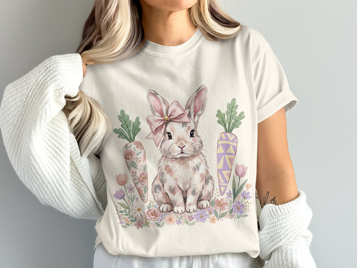 Cream t-shirt with a watercolor Easter bunny, carrots, and flowers.