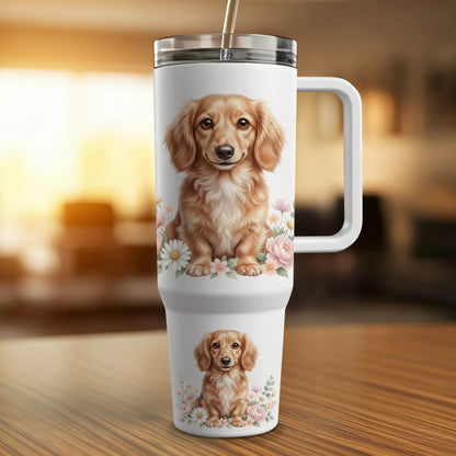 White tumbler with dachshund illustration, handle, and straw.