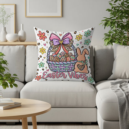 Easter Vibes basket with eggs, bunny, and flowers on decorative pillow.