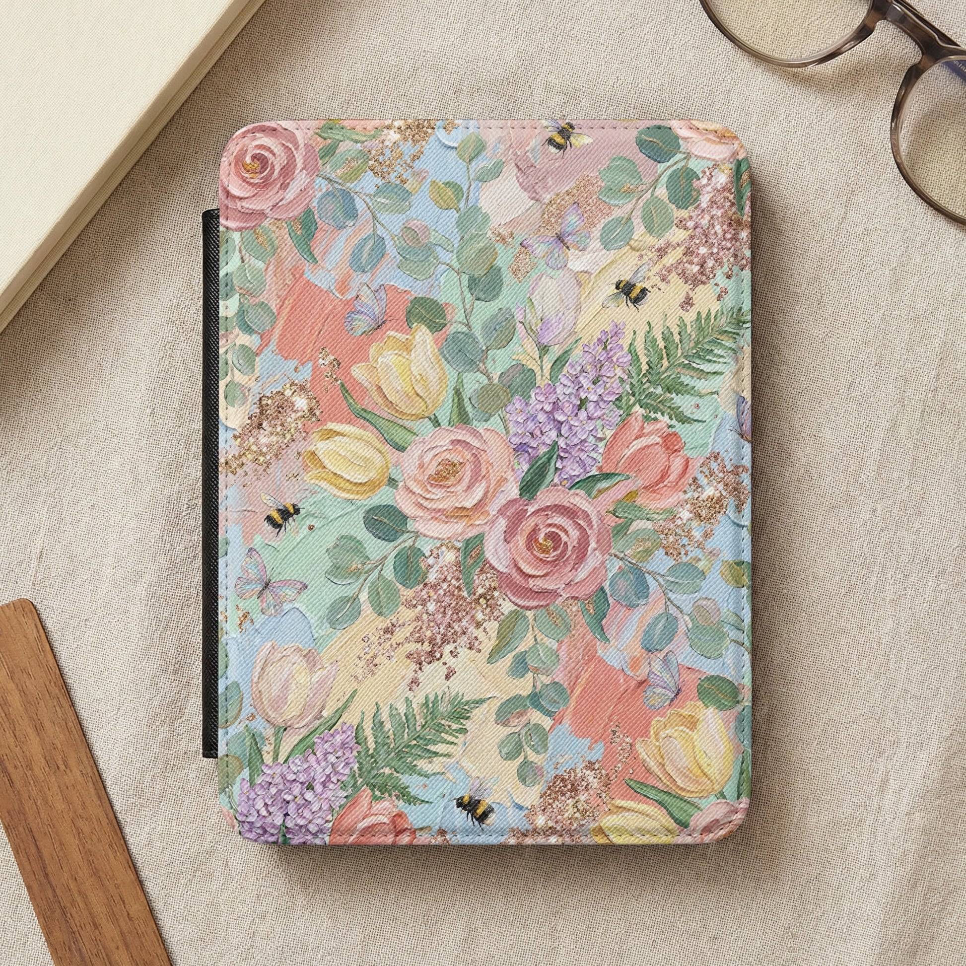 Floral and bumblebee patterned case for an e-reader or tablet.