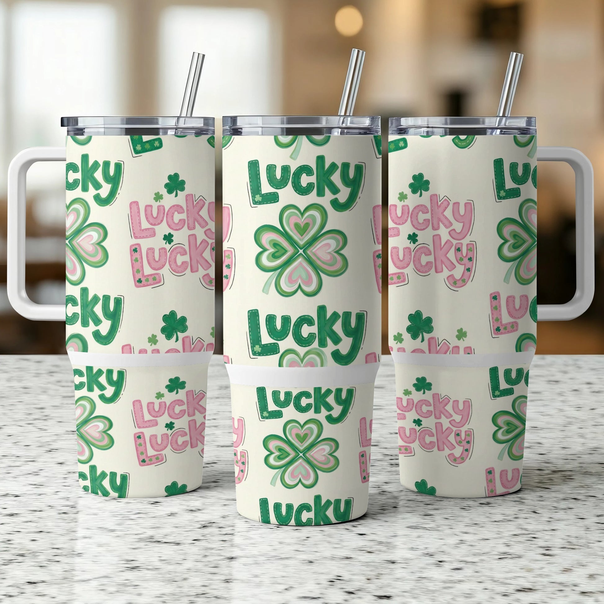 Three travel mugs with "Lucky" and shamrock patterns.