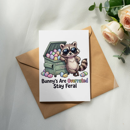 Card with raccoon and Easter eggs, text "Bunny's Are Overrated Stay Feral".