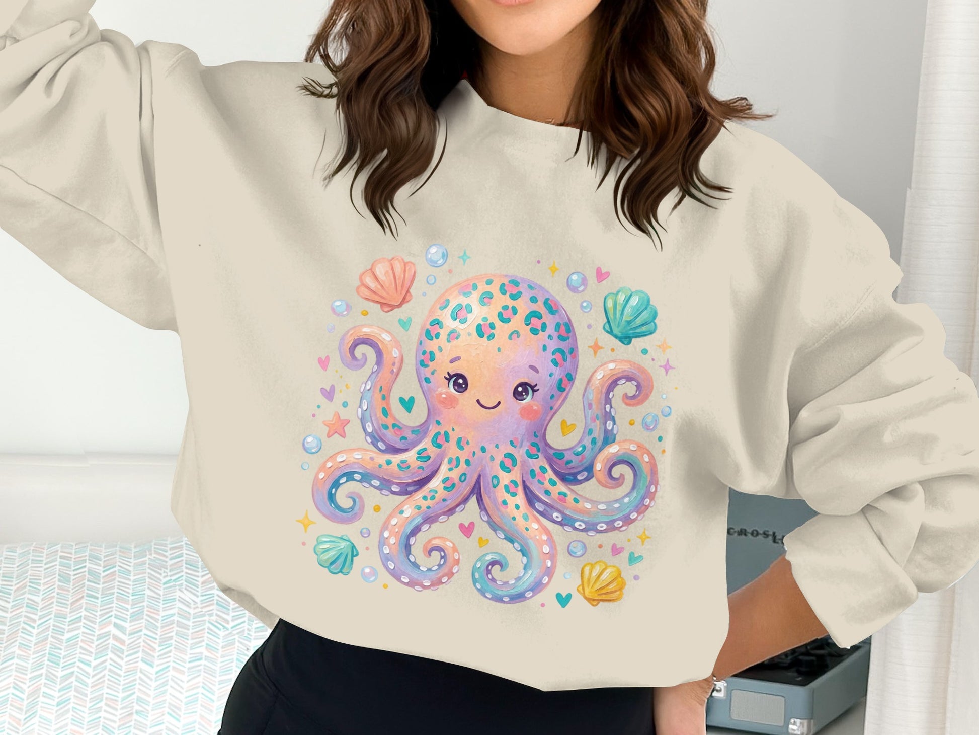Crewneck sweatshirt with a cute pastel octopus and seashells design.