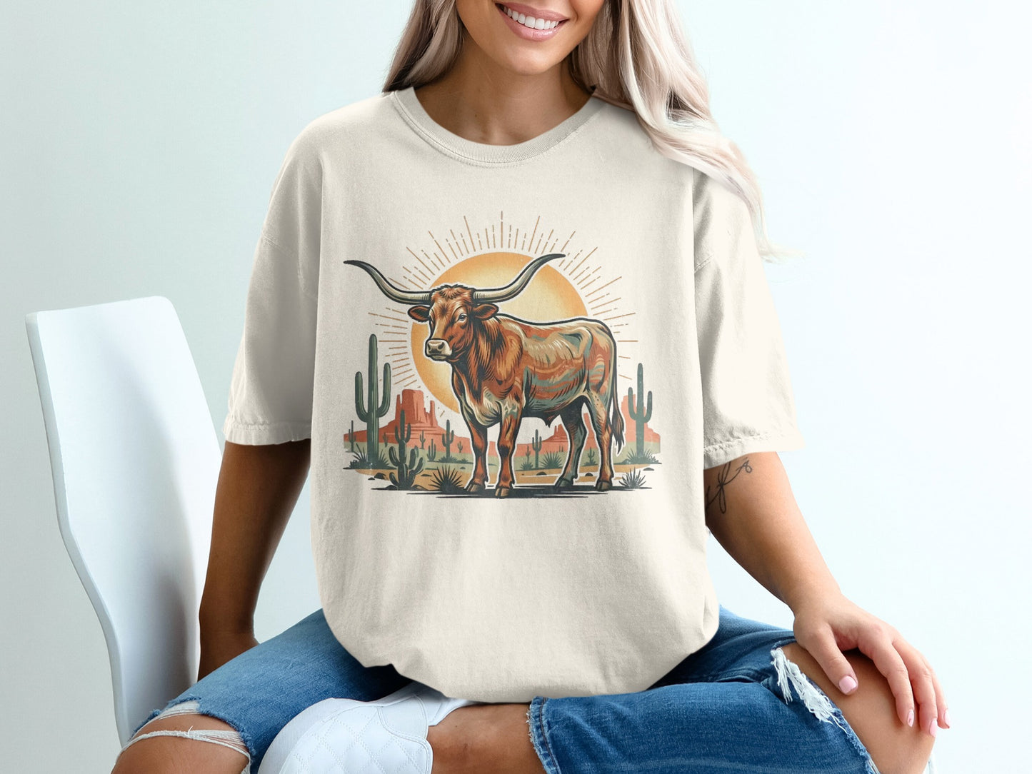 T-shirt with a longhorn steer and desert landscape graphic.