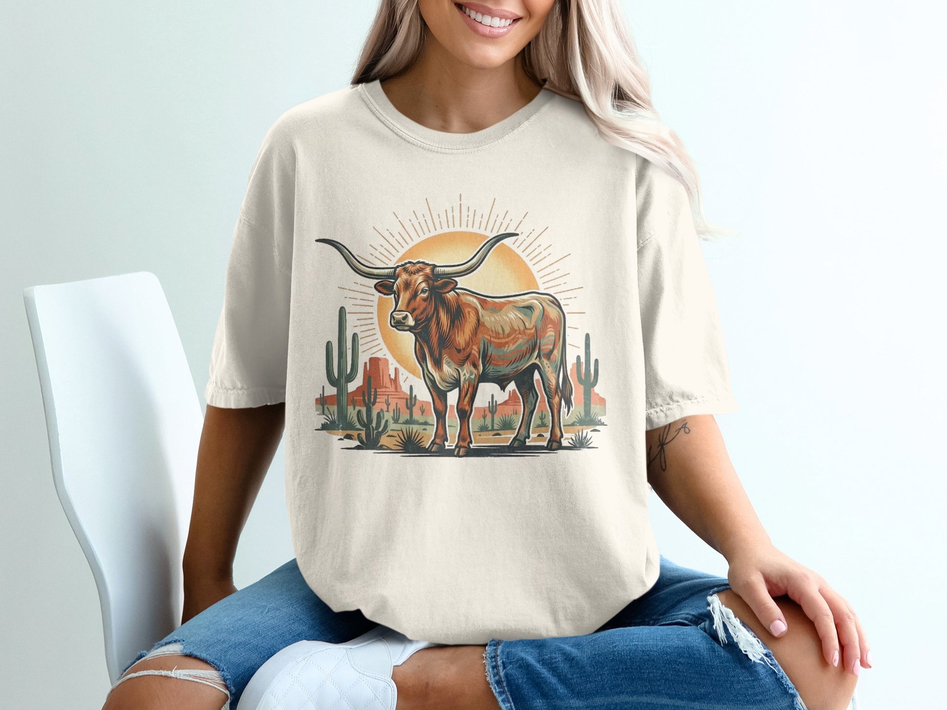 T-shirt with a longhorn steer and desert landscape graphic.