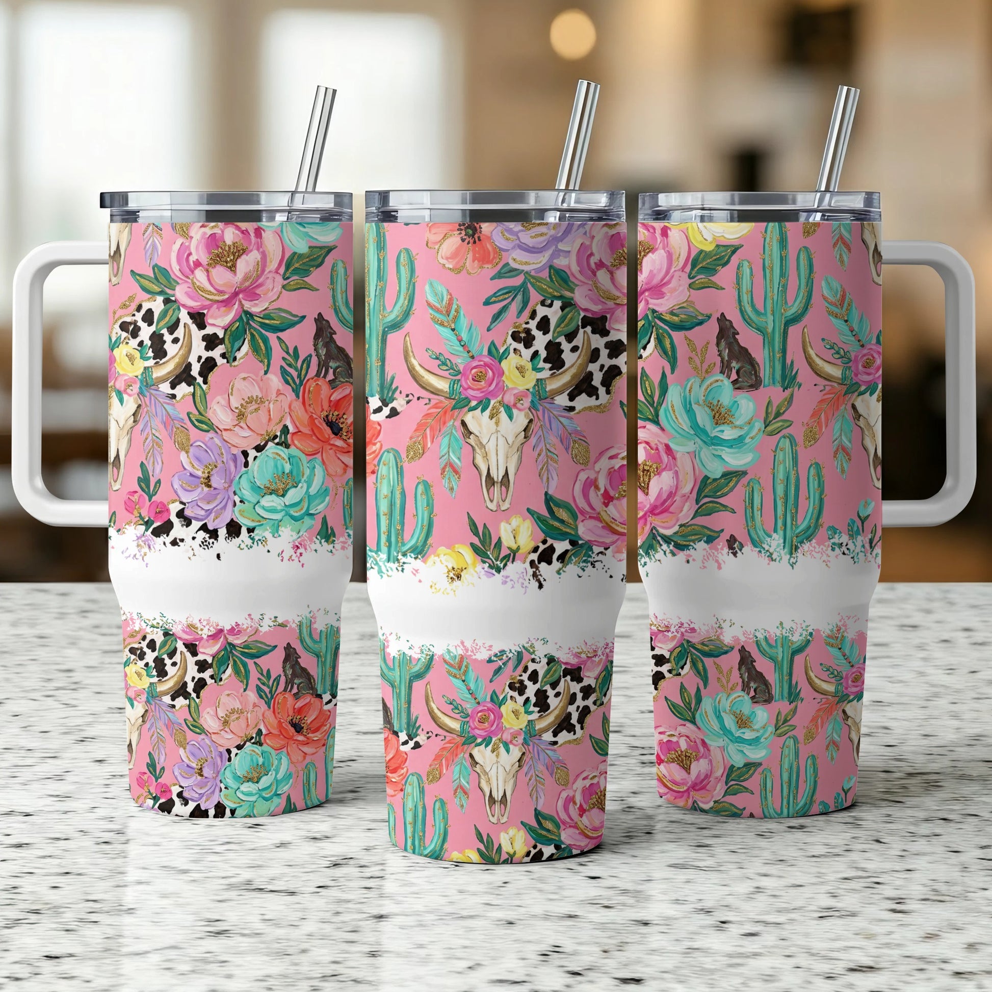 Pink tumbler with cow skull and floral, cactus pattern.