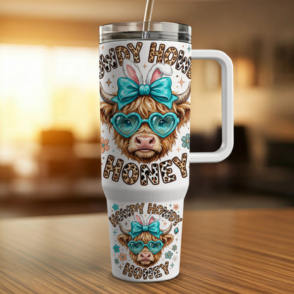 Cow print tumbler with heart glasses and bunny ears reading "Howdy Honey".